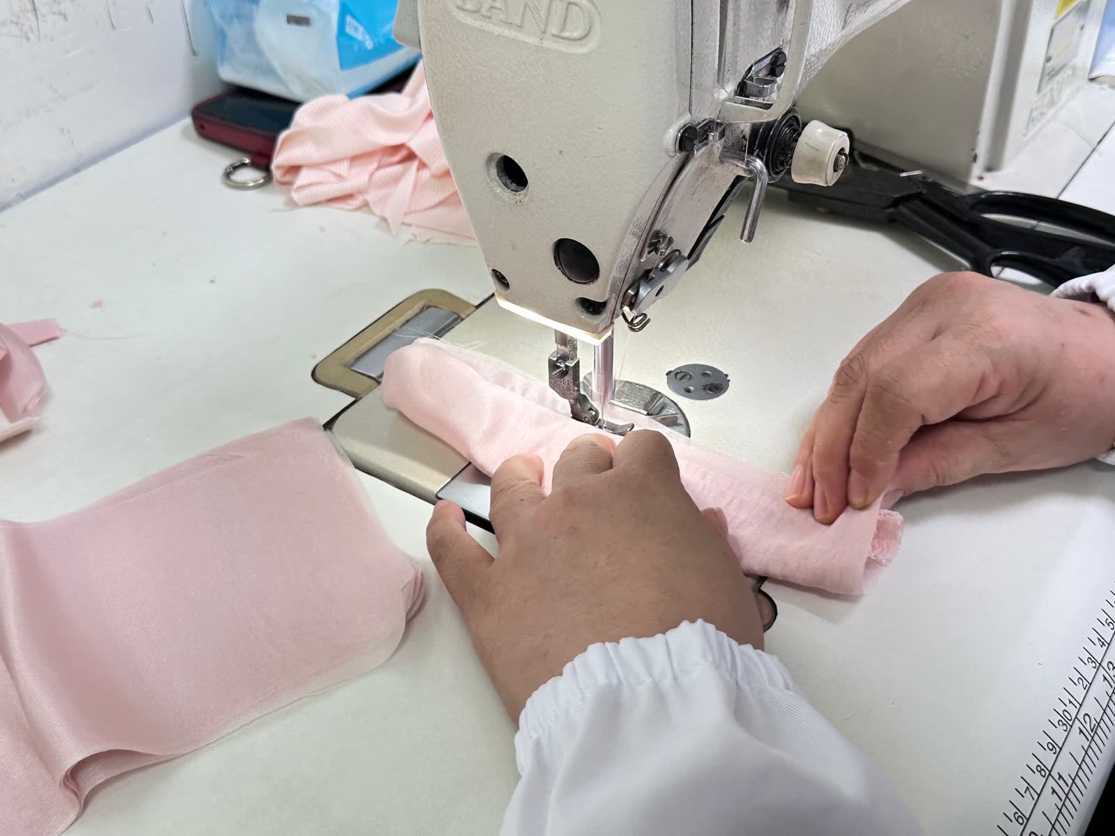 Final garment check on the cutting table before packing