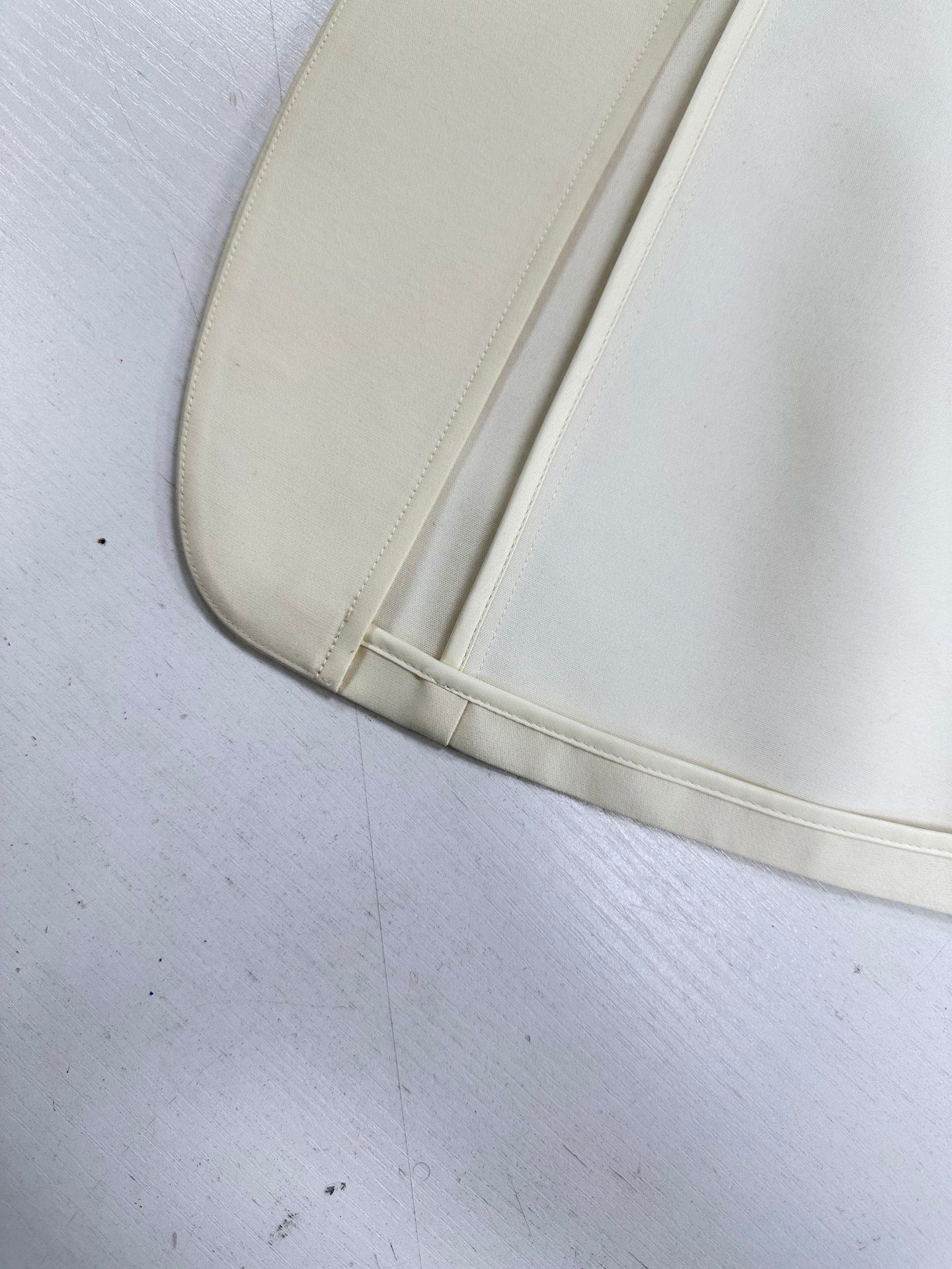 Pick-stitched hem inside an unlined blazer, UP Fashion Guangzhou