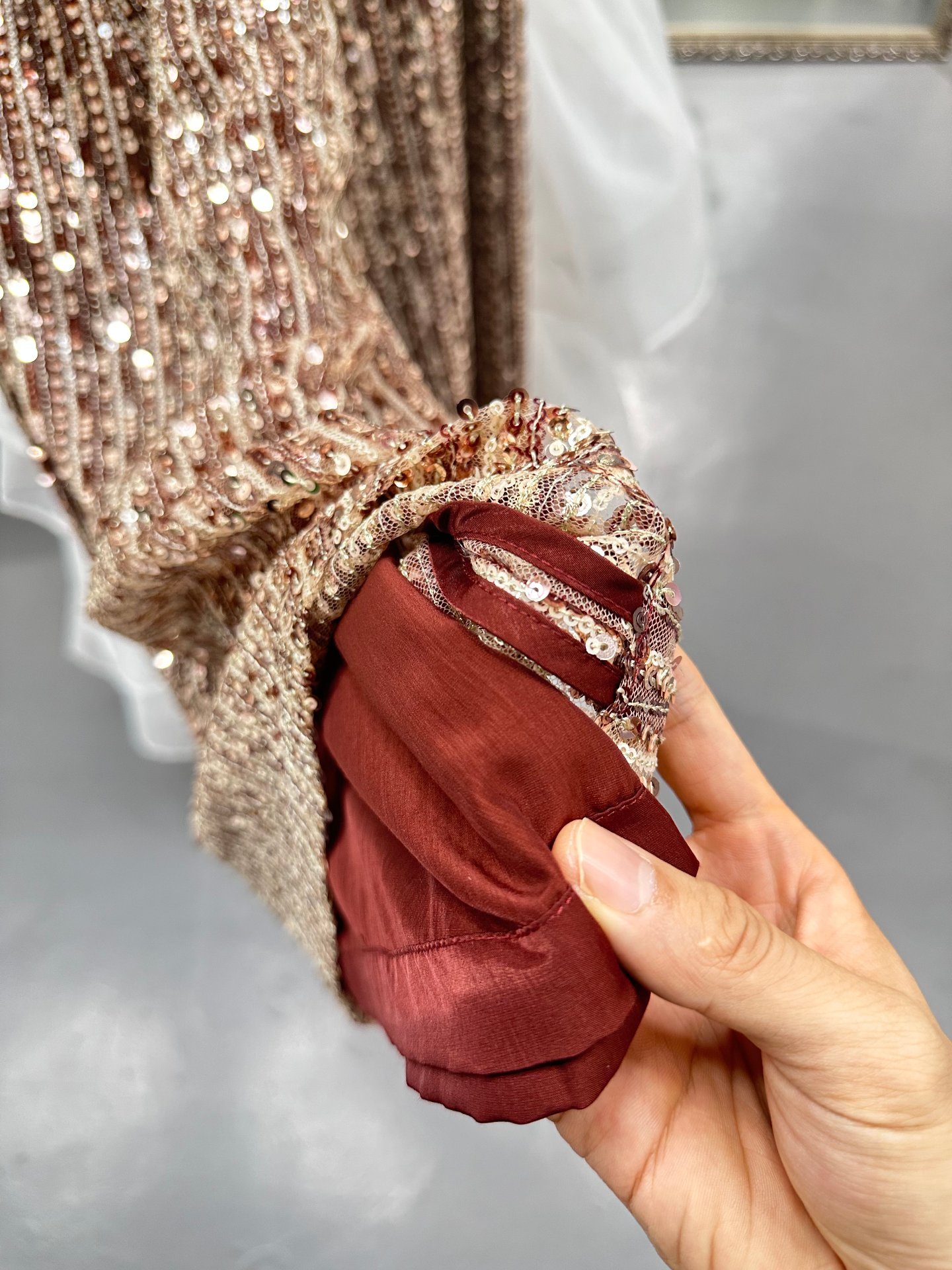 Sequin trouser edge bound with matching wine-red lining binding, UP Fashion Guangzhou