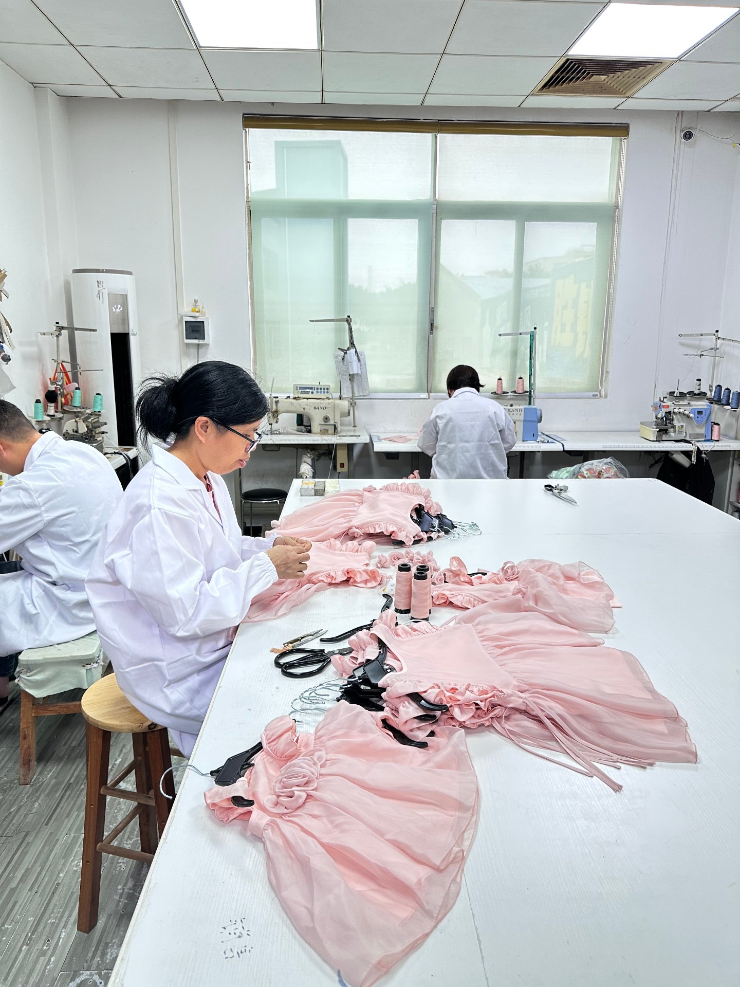 Hand finishing pink chiffon dresses